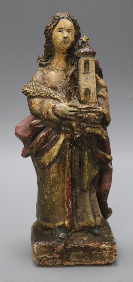 A South American polychrome painted terracotta figure of a saint height 27cm